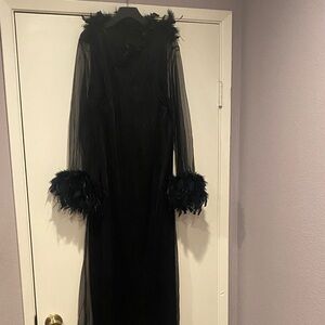 Used Black Dress /Halloween Costume with Feathers on the collar and sleeves.
